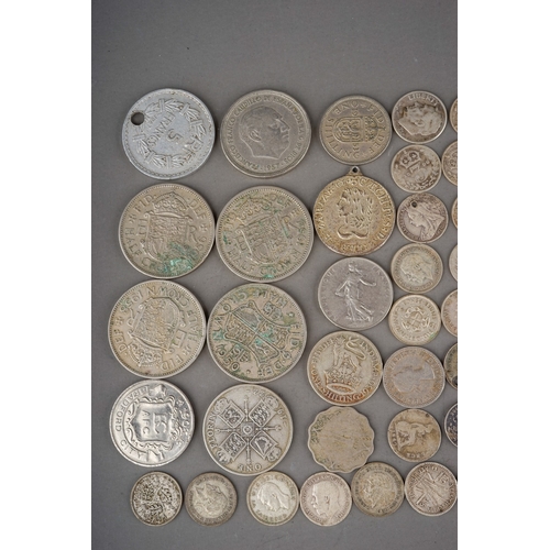 304 - Coins: a Hignetts Pilot Flake tin containing over eighty threepence pieces, mostly Victorian and Edw... 