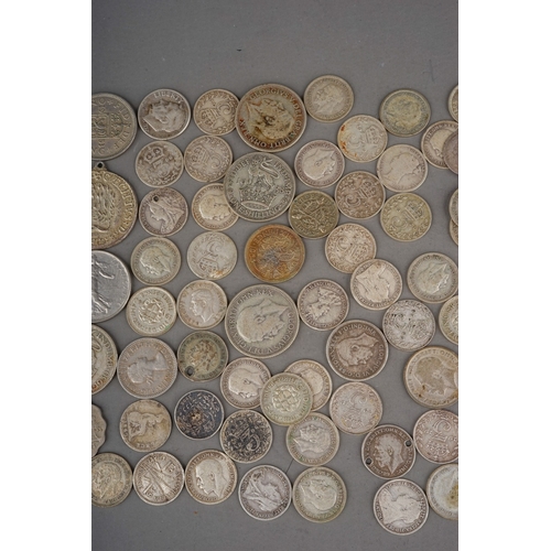 304 - Coins: a Hignetts Pilot Flake tin containing over eighty threepence pieces, mostly Victorian and Edw... 