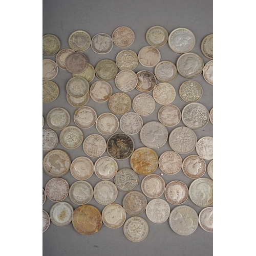 304 - Coins: a Hignetts Pilot Flake tin containing over eighty threepence pieces, mostly Victorian and Edw... 