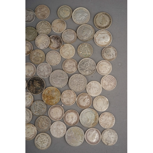 304 - Coins: a Hignetts Pilot Flake tin containing over eighty threepence pieces, mostly Victorian and Edw... 