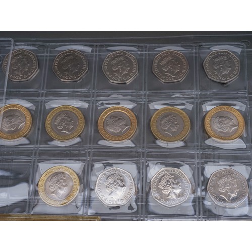 319 - A collection of coins and stamps in folder and loose, coins include fifty seven £2 coins, approximat... 