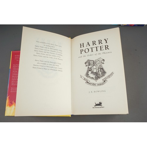 321 - J. K Rowling, Nine Harry Potter hardback books, comprising the first three books (Philosophers Stone... 