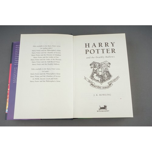 321 - J. K Rowling, Nine Harry Potter hardback books, comprising the first three books (Philosophers Stone... 