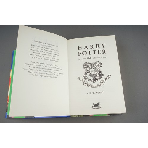 321 - J. K Rowling, Nine Harry Potter hardback books, comprising the first three books (Philosophers Stone... 