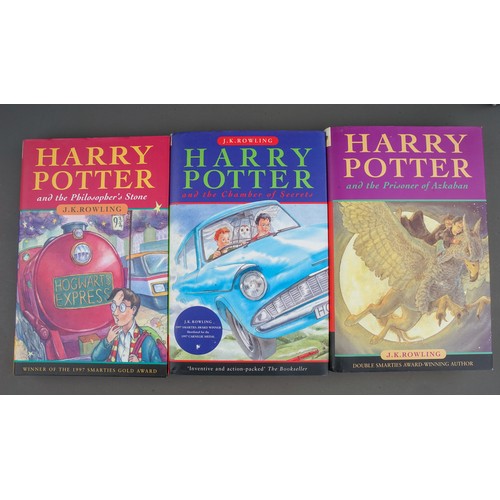 321 - J. K Rowling, Nine Harry Potter hardback books, comprising the first three books (Philosophers Stone... 