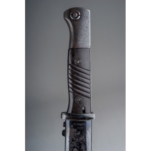 330 - A WW2 Third Reich Mauser K98 bayonet by Berg & Co  complete with scabbard, with matching serial numb... 