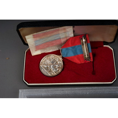 336 - A cased Elizabeth II Faithful Service medal awarded to Edwin Woodhall Strachan, with spare ribbon, a... 