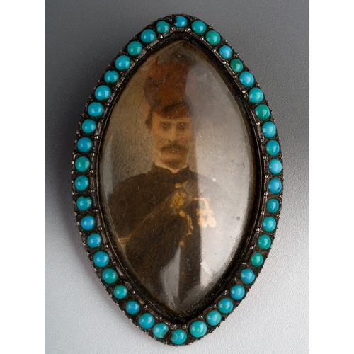 348 - A 19th century navette memorial pendant, set with a photographic portrait of a military gentleman, w... 