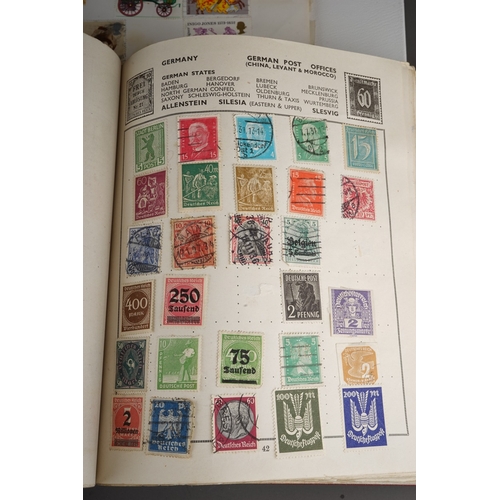 352 - A collection of stamps housed in a ring bound folder, a Godden Royal Mail album, a Quickchange album... 