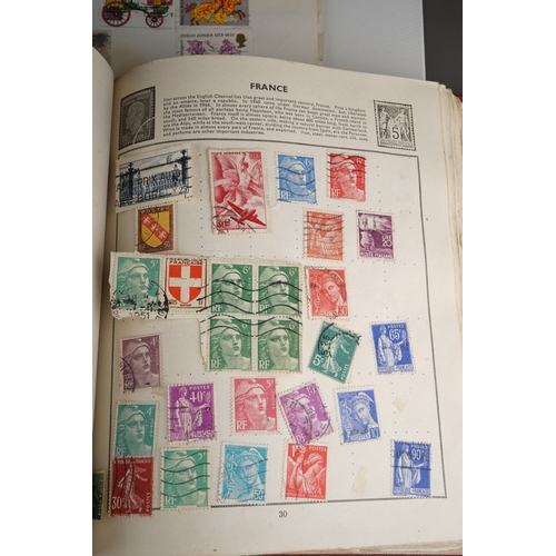 352 - A collection of stamps housed in a ring bound folder, a Godden Royal Mail album, a Quickchange album... 