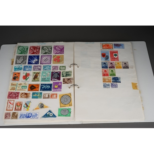 352 - A collection of stamps housed in a ring bound folder, a Godden Royal Mail album, a Quickchange album... 