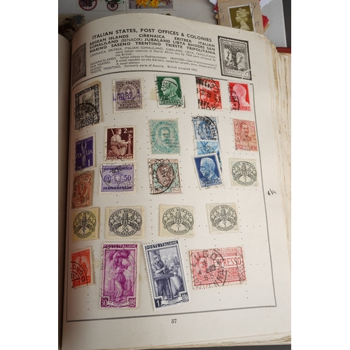 352 - A collection of stamps housed in a ring bound folder, a Godden Royal Mail album, a Quickchange album... 