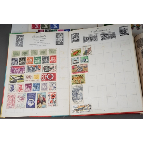 352 - A collection of stamps housed in a ring bound folder, a Godden Royal Mail album, a Quickchange album... 