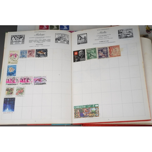 352 - A collection of stamps housed in a ring bound folder, a Godden Royal Mail album, a Quickchange album... 