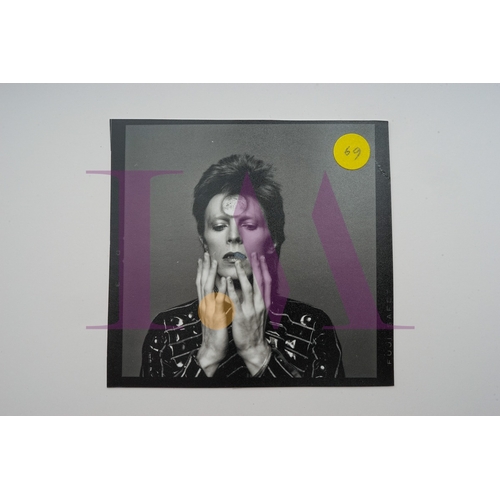 354 - DAVID BOWIE - Cut Contact Sheets Sukita Photo collection.
This black velvet hard cover book has been... 