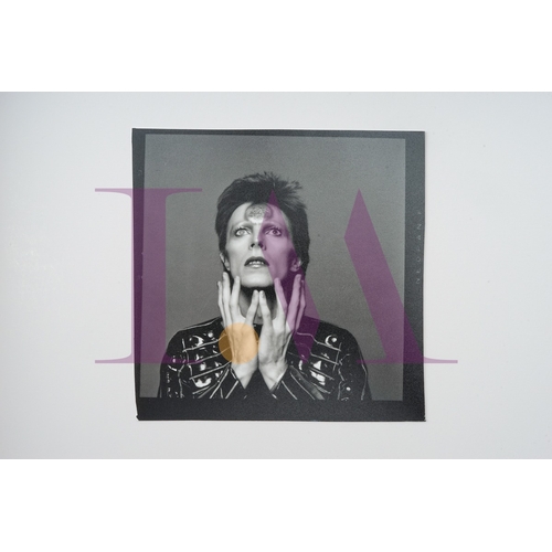 354 - DAVID BOWIE - Cut Contact Sheets Sukita Photo collection.
This black velvet hard cover book has been... 