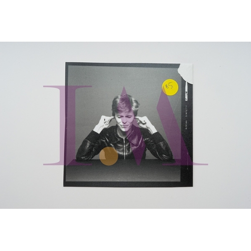 354 - DAVID BOWIE - Cut Contact Sheets Sukita Photo collection.
This black velvet hard cover book has been... 