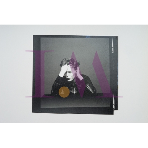 354 - DAVID BOWIE - Cut Contact Sheets Sukita Photo collection.
This black velvet hard cover book has been... 