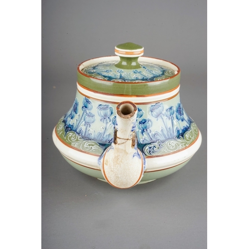 362 - A Moorcroft Macintyre tea pot of squat baluster form, tube line decorated with blue poppies on a gre... 