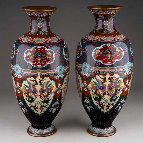 365 - A pair of early 20th century cloisonne ovoid vases, decorated with panels of dragons, exotic birds a... 