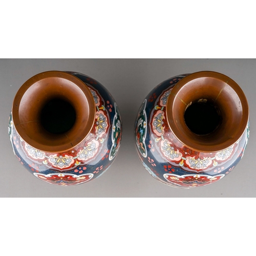 365 - A pair of early 20th century cloisonne ovoid vases, decorated with panels of dragons, exotic birds a... 