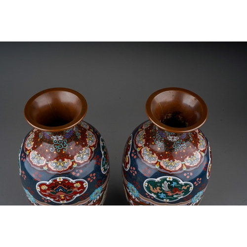 365 - A pair of early 20th century cloisonne ovoid vases, decorated with panels of dragons, exotic birds a... 