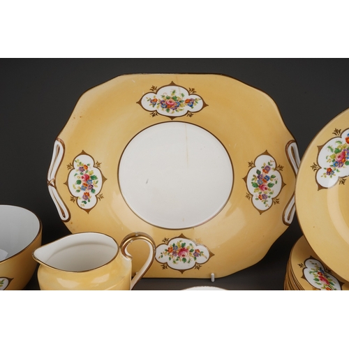 366 - A Crown Chelsea China tea set, apricot ground with printed and painted panels of flowers, comprising... 