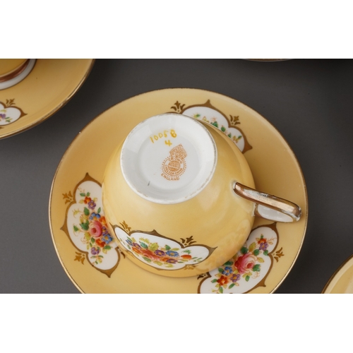 366 - A Crown Chelsea China tea set, apricot ground with printed and painted panels of flowers, comprising... 