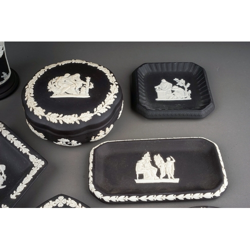 367 - A collection of thirteen pieces of 20th century black basalt Wedgwood, including three trinket boxes... 