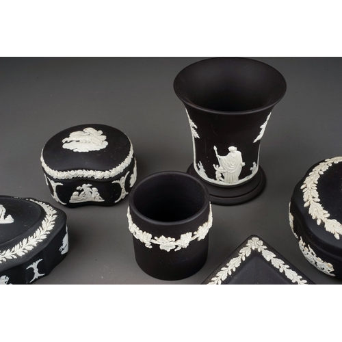 367 - A collection of thirteen pieces of 20th century black basalt Wedgwood, including three trinket boxes... 