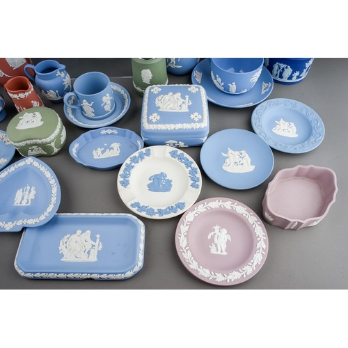 369 - A collection of Wedgwood jasperware in terracotta, lilac, green, yellow, pale blue, dark blue and wh... 