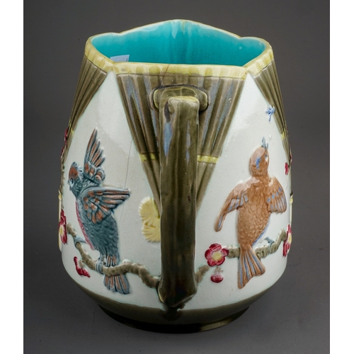 371 - A late 19th century Wedgwood majolica jug, relief decorated in the Aesthetic taste with fans and bir... 