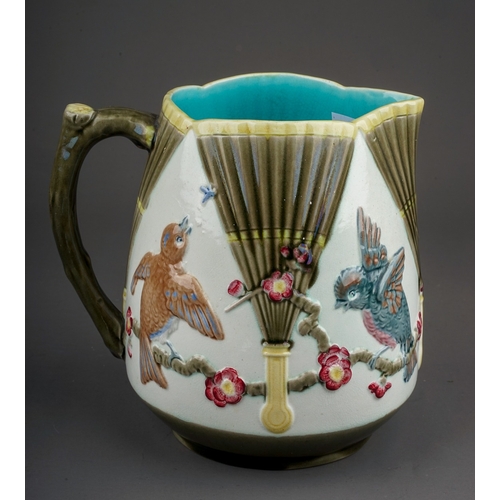 371 - A late 19th century Wedgwood majolica jug, relief decorated in the Aesthetic taste with fans and bir... 