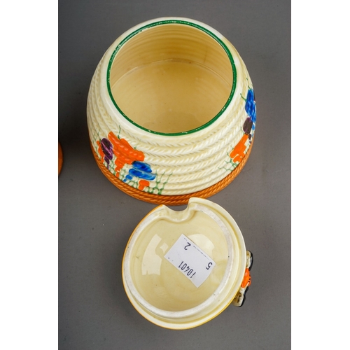 372 - Two items of Clarice Cliff Bizarre Crocus pattern for Newport Pottery, comprising a honey pot and co... 