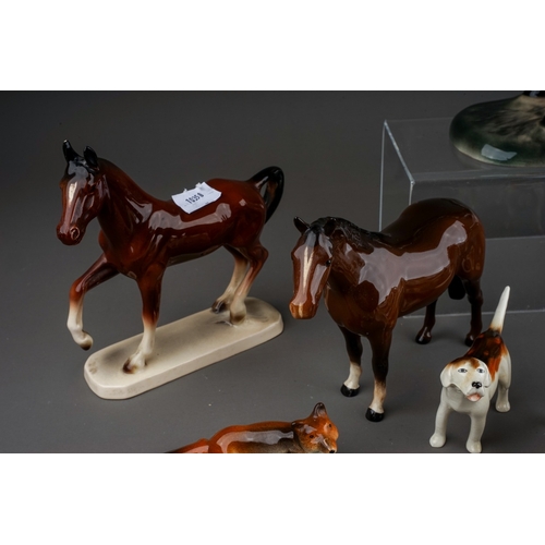 376 - A group of Beswick, Wade and other animal ceramics, including a Beswick Welsh Cob (rearing), model n... 