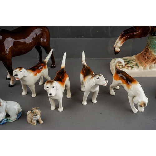 376 - A group of Beswick, Wade and other animal ceramics, including a Beswick Welsh Cob (rearing), model n... 