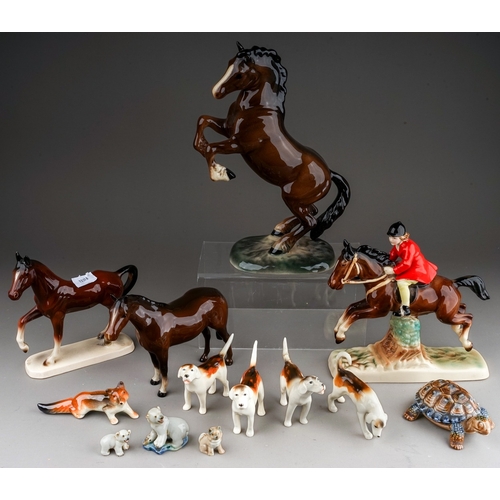 376 - A group of Beswick, Wade and other animal ceramics, including a Beswick Welsh Cob (rearing), model n... 