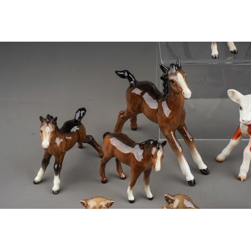 378 - A collection of thirteen small Beswick animals, including Hereford calf 901b, Bush Baby with mirror ... 