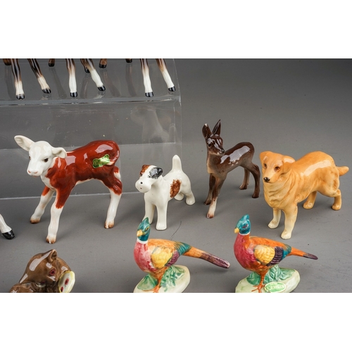 378 - A collection of thirteen small Beswick animals, including Hereford calf 901b, Bush Baby with mirror ... 