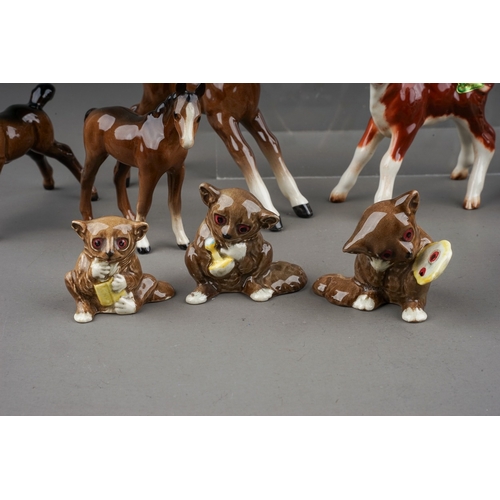 378 - A collection of thirteen small Beswick animals, including Hereford calf 901b, Bush Baby with mirror ... 