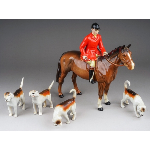 380 - A Beswick Huntsman standing on brown gloss horse, model no. 1501 and four Beswick foxhounds, all in ... 