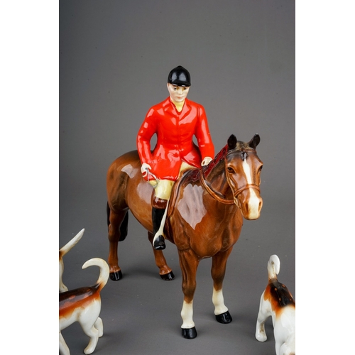 380 - A Beswick Huntsman standing on brown gloss horse, model no. 1501 and four Beswick foxhounds, all in ... 