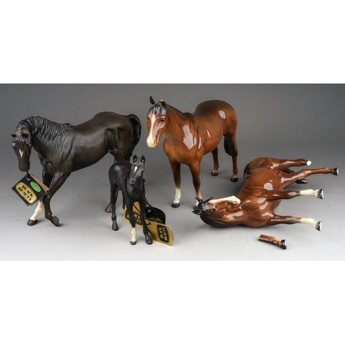 381 - Four Beswick horses foal, comprising Black Beauty, matt, model no.2466, Black Beauty foal, matt, mod... 