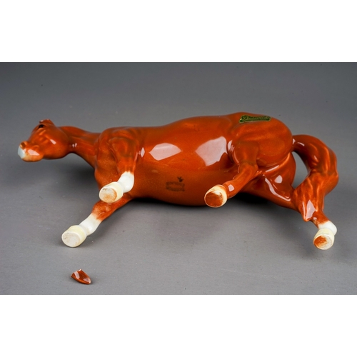 382 - A rare Beswick Boys Pony in chestnut gloss, model no.1480, height in 9.5cm, one ear broken but loose... 