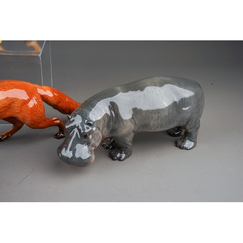 383 - Seven assorted Beswick animals, comprising a Hippo, gloss, model no.1532, Tigress, gloss model no. 1... 