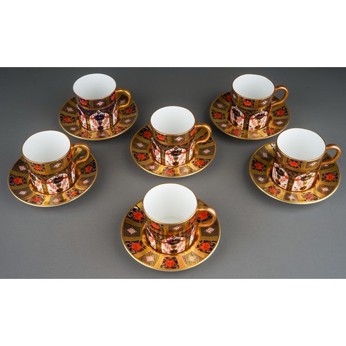 390 - A set of six Royal Crown Derby Imari 1128 solid gold band coffee cans and saucers, five bear date co... 