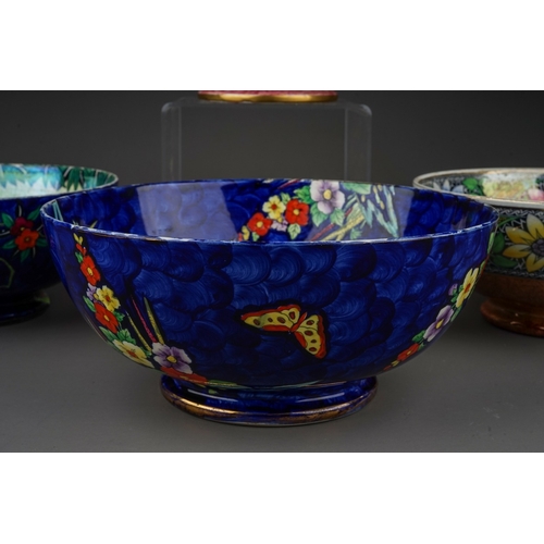 426 - A group of five Maling lustre ware bowls to include: 
1. Bouquet with sunflowers, pattern no 6325, c... 