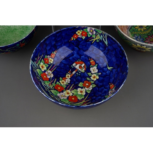 426 - A group of five Maling lustre ware bowls to include: 
1. Bouquet with sunflowers, pattern no 6325, c... 