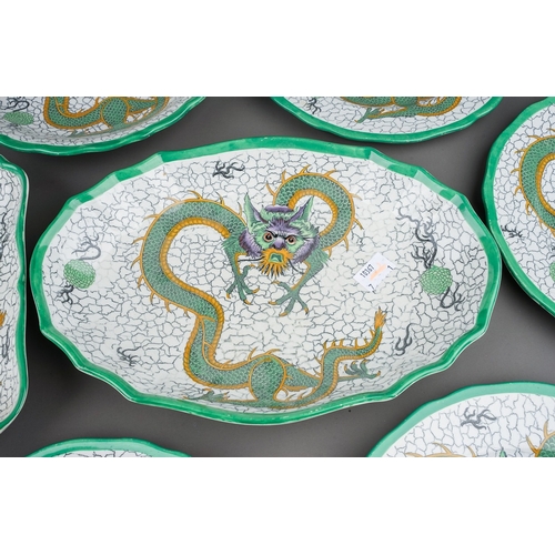 430 - A Copeland Late Spode ten piece dessert service printed and tinted with a green dragon on a crackle ... 