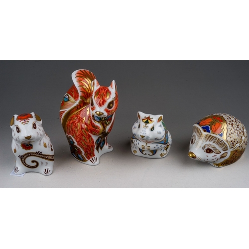 457 - Four Royal Crown Derby paperweights, comprising Hawthorn hedgehog, Woodland Squirrel, Mouse, Hamster... 